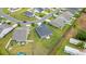 An aerial shot capturing the house's backyard, adjacent properties, and neighborhood layout at 232 Red Maple Loop, Longs, SC 29568