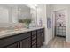Bathroom with double vanity, granite countertops, dark cabinets and decorative accents at 232 Red Maple Loop, Longs, SC 29568