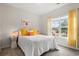 Cozy bedroom featuring a bed, window with curtains, and neutral color scheme, creating a peaceful atmosphere at 232 Red Maple Loop, Longs, SC 29568
