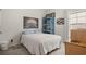 Bright bedroom featuring bed with quilt and accent furniture, with light coming through a window at 232 Red Maple Loop, Longs, SC 29568