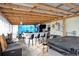Fun backyard bar area with seating, lighting, and space for entertainment at 238 Robin Dr., Georgetown, SC 29440