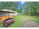 Large backyard with green grass, mature trees, and space for outdoor activities at 238 Robin Dr., Georgetown, SC 29440