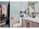 Bathroom features wood vanity, a toilet, and a quirky fox statue at 238 Robin Dr., Georgetown, SC 29440