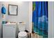 Bathroom with a white vanity, mirror and an enclosed shower with a beach themed curtain at 238 Robin Dr., Georgetown, SC 29440