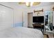 Charming bedroom with ceiling fan, television, and convenient closet space at 238 Robin Dr., Georgetown, SC 29440