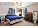 Relaxing bedroom with a ceiling fan, window, dresser, and rug creating a calm space at 238 Robin Dr., Georgetown, SC 29440