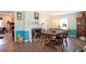 Cozy dining room with fireplace and hardwood floors; ample seating and natural light at 238 Robin Dr., Georgetown, SC 29440
