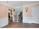 Inviting foyer with wooden floors and staircase leading to the upper level of this home at 238 Robin Dr., Georgetown, SC 29440
