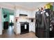Modern kitchen with stainless appliances, white cabinets, and access to dining area at 238 Robin Dr., Georgetown, SC 29440