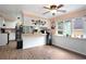 Eat-in kitchen featuring white cabinets, hardwood floors, ceiling fan, and ample counter space at 238 Robin Dr., Georgetown, SC 29440