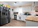 Bright kitchen with stainless steel appliances, white cabinets, and butcher block countertops at 238 Robin Dr., Georgetown, SC 29440