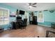 Spacious office features a desk, computer, TV, gun safes, and natural light at 238 Robin Dr., Georgetown, SC 29440