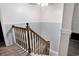 Classic wooden staircase with white and gray walls and wood-look flooring at 238 Robin Dr., Georgetown, SC 29440