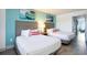 Welcoming bedroom with two beds, soft lighting, and artistic wall decor at 2401 S Ocean Blvd. # 557, Myrtle Beach, SC 29577