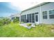 Relaxing screened-in patio with a barbecue, perfect for outdoor dining and entertaining at 251 Juniata Loop, Little River, SC 29566