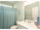 Fresh bathroom with a wide vanity and a shower with a soothing light blue curtain at 251 Juniata Loop, Little River, SC 29566