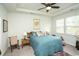 Bedroom featuring a plush bed, ceiling fan, and relaxing natural light from the window at 251 Juniata Loop, Little River, SC 29566