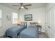 Comfortable bedroom with two twin beds, soft carpet, a ceiling fan and natural light from a window at 251 Juniata Loop, Little River, SC 29566