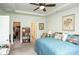 Comfortable bedroom featuring a tray ceiling, walk-in closet, and an adjacent room for added convenience at 251 Juniata Loop, Little River, SC 29566