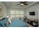 Bedroom with a comfortable queen size bed, ceiling fan, and natural light from the window at 251 Juniata Loop, Little River, SC 29566