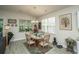 Charming dining area with a round table, wooden chairs, and a window offering natural light and outside views at 251 Juniata Loop, Little River, SC 29566