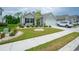 Landscaped front yard with lush green grass and decorative stone accents at 251 Juniata Loop, Little River, SC 29566