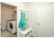 Laundry room with newer washer and dryer units, storage and attached bench with coat hooks at 251 Juniata Loop, Little River, SC 29566