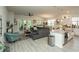 Bright, open-concept living room featuring hardwood floors, neutral colors, and access to an outdoor patio at 251 Juniata Loop, Little River, SC 29566