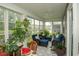 Screened porch with an outdoor seating area, plants, and picturesque outdoor views at 251 Juniata Loop, Little River, SC 29566