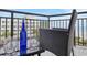 Relaxing ocean-view balcony with outdoor furniture and a bottle of wine at 2710 N Ocean Blvd. # 402, Myrtle Beach, SC 29577