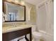 Well-lit bathroom featuring granite countertop, vanity, tub and updated fixtures at 2710 N Ocean Blvd. # 402, Myrtle Beach, SC 29577