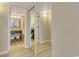 Well-lit bathroom showcasing tile flooring, granite countertops, and mirrored closet at 2710 N Ocean Blvd. # 402, Myrtle Beach, SC 29577