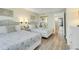 Comfortable bedroom featuring two queen beds with decorative headboards and mirrored closet at 2710 N Ocean Blvd. # 402, Myrtle Beach, SC 29577