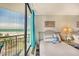 Bright bedroom with ocean view, stylish decor, and comfortable beds perfect for relaxation at 2710 N Ocean Blvd. # 402, Myrtle Beach, SC 29577