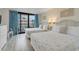 Bright bedroom featuring two beds, neutral walls, balcony access and plenty of space at 2710 N Ocean Blvd. # 402, Myrtle Beach, SC 29577