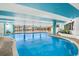 Indoor pool area with floor-to-ceiling windows and a bright, airy atmosphere at 2710 N Ocean Blvd. # 402, Myrtle Beach, SC 29577
