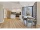 Modern kitchen with stainless steel appliances and an open dining and living area at 2710 N Ocean Blvd. # 402, Myrtle Beach, SC 29577