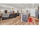 A bright and inviting living room with an island connected to the kitchen with modern decor and furniture at 2757 Zenith Way, Myrtle Beach, SC 29577