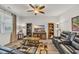 Cozy living room with recliners, decorative shelving and a window letting in plenty of natural light at 2757 Zenith Way, Myrtle Beach, SC 29577
