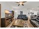 The open-concept living room has a comfortable recliner sofa and a modern entertainment center at 2757 Zenith Way, Myrtle Beach, SC 29577