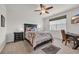 Inviting main bedroom with a comfortable bed, nightstands, ceiling fan, and natural light at 2757 Zenith Way, Myrtle Beach, SC 29577