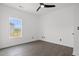 Bright bedroom with ceiling fan, wood floor and window view at 2951 Mary Hines Ln., Georgetown, SC 29440