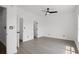 Bedroom features hard surface flooring, a ceiling fan, and white walls at 2951 Mary Hines Ln., Georgetown, SC 29440