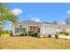 Charming single-story home with manicured lawn, attached garage, and welcoming curb appeal at 2951 Mary Hines Ln., Georgetown, SC 29440