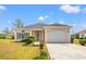 Single-story home with blue shutters, a front yard, and an attached one car garage at 2951 Mary Hines Ln., Georgetown, SC 29440