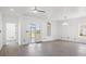 Bright living room with gray flooring, modern lighting, and access to an outdoor patio at 2951 Mary Hines Ln., Georgetown, SC 29440