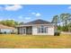 Rear exterior view of the home with screened porch at 2951 Mary Hines Ln., Georgetown, SC 29440