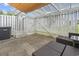 Outdoor patio area with seating, privacy fence, and shade; ideal for outdoor living at 3008 Church St. # D3, Myrtle Beach, SC 29577