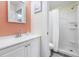 Bathroom featuring a single sink vanity with a mirror, accented by a painted wall and walk-in shower at 3008 Church St. # D3, Myrtle Beach, SC 29577