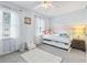 Bright bedroom with a trundle bed, soft carpet, and natural light from the large windows at 3008 Church St. # D3, Myrtle Beach, SC 29577